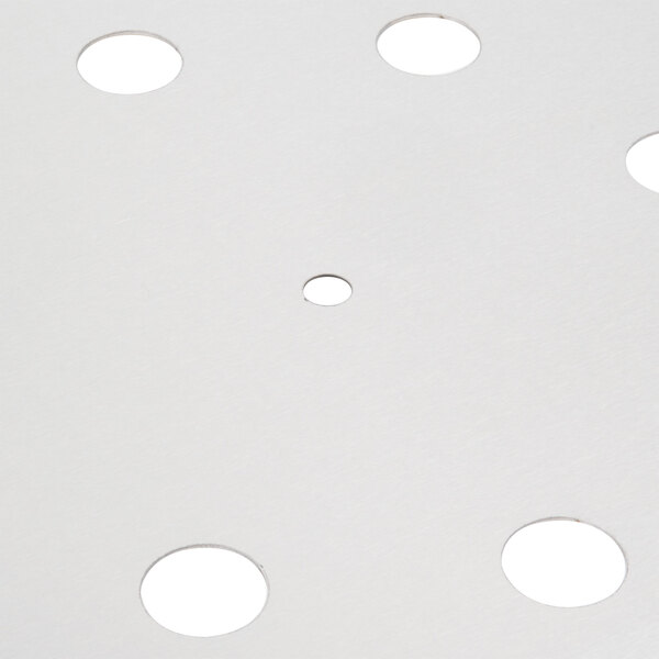 A white circle with holes in it.