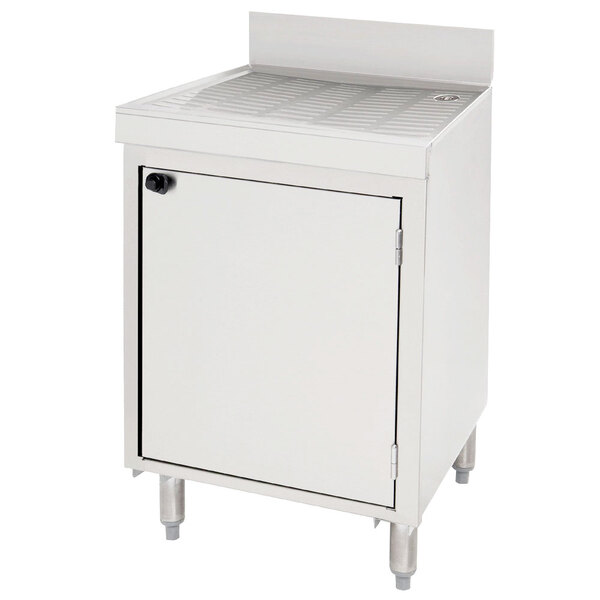 A white Advance Tabco stainless steel drainboard storage cabinet with a door.