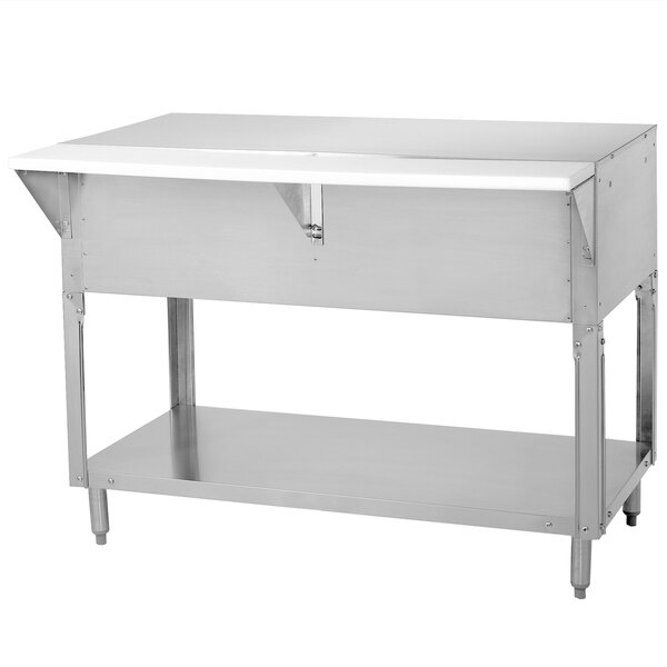 A stainless steel Advance Tabco food table with undershelf on a counter.
