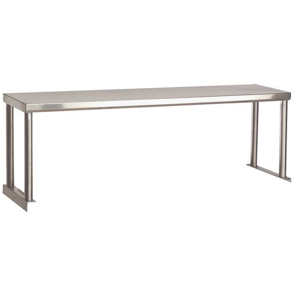 A stainless steel Advance Tabco single overshelf on a long rectangular table.