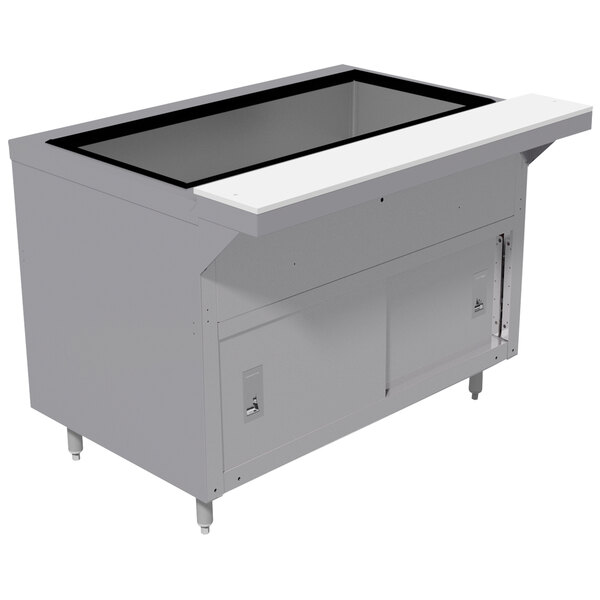 A stainless steel Advance Tabco heavy-duty ice-cooled table with sliding doors on a counter.