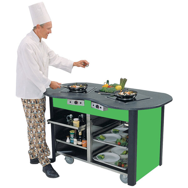 A chef cooking food on a Lakeside stainless steel induction cooking cart with green laminate finish.