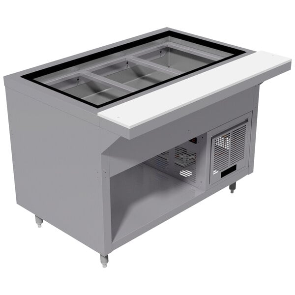 A stainless steel Advance Tabco refrigerated cold table with an enclosed base.