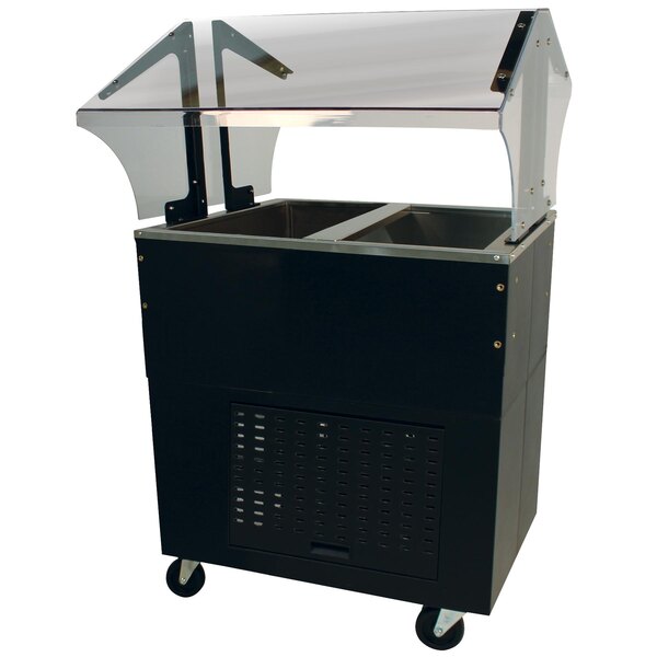 A black rectangular Advance Tabco buffet cold pan table with a clear cover on a counter.