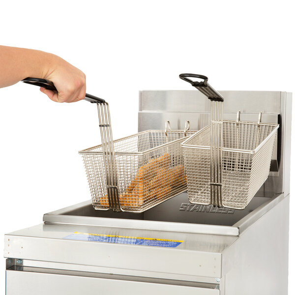 A hand using Anets fryer baskets to fry food in a deep fryer.