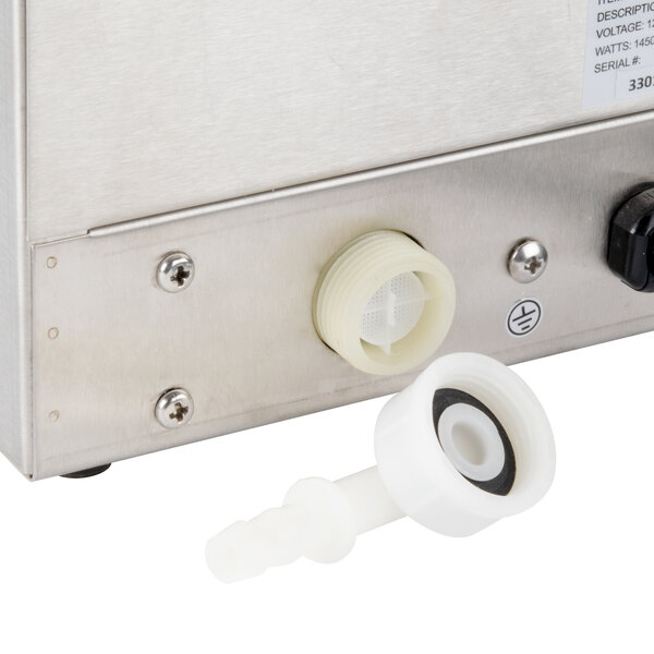 A close-up of a white plastic male fitting for a hot water dispenser.