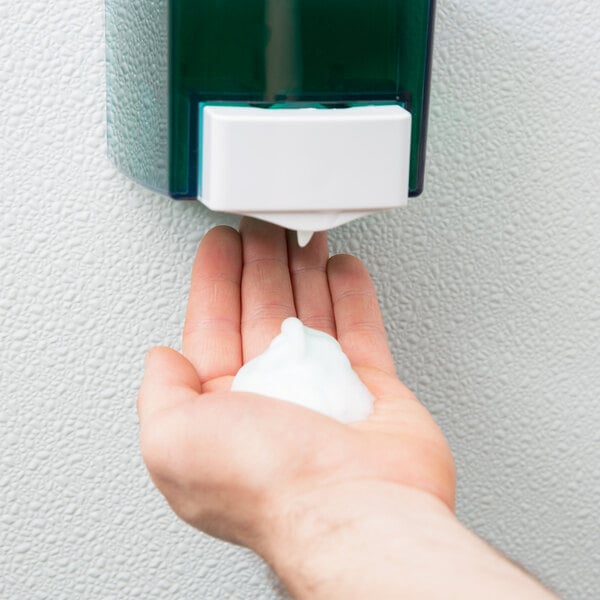 A person's hand with foam from Noble Chemical Novo ready-to-use foaming hand soap.
