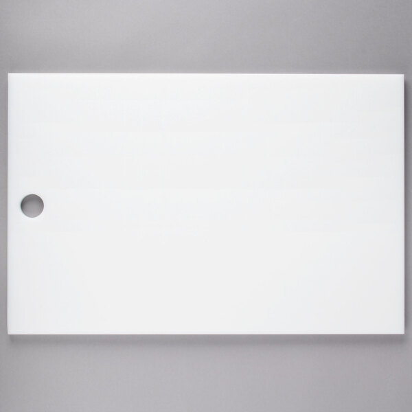 A white rectangular object with a hole in the middle.
