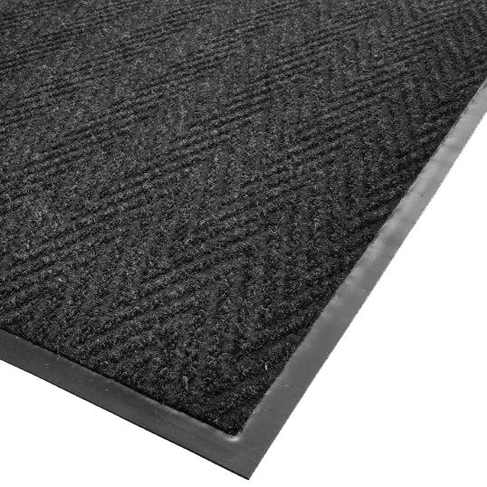 A black Cactus Mat Chevron Rib herringbone scraper mat with a black border.