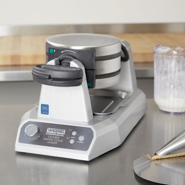 A Waring double waffle cone maker on a counter.