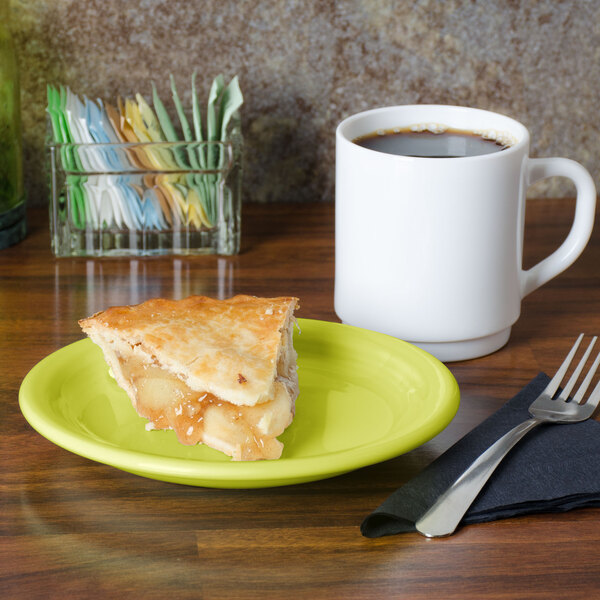 A Fiesta® lemongrass appetizer plate with a slice of pie next to a white mug of coffee.