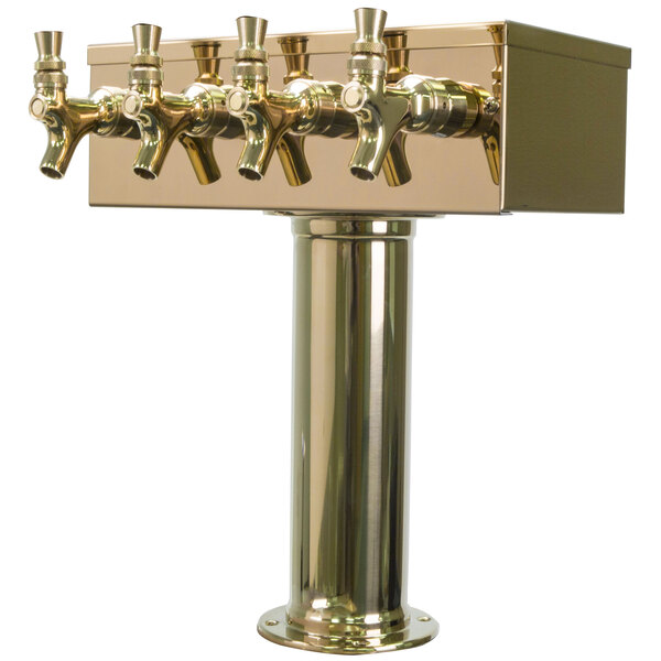 A gold metal Micro Matic beer tap tower with four taps.