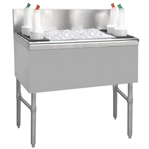 A stainless steel Advance Tabco underbar ice bin with two ice trays.