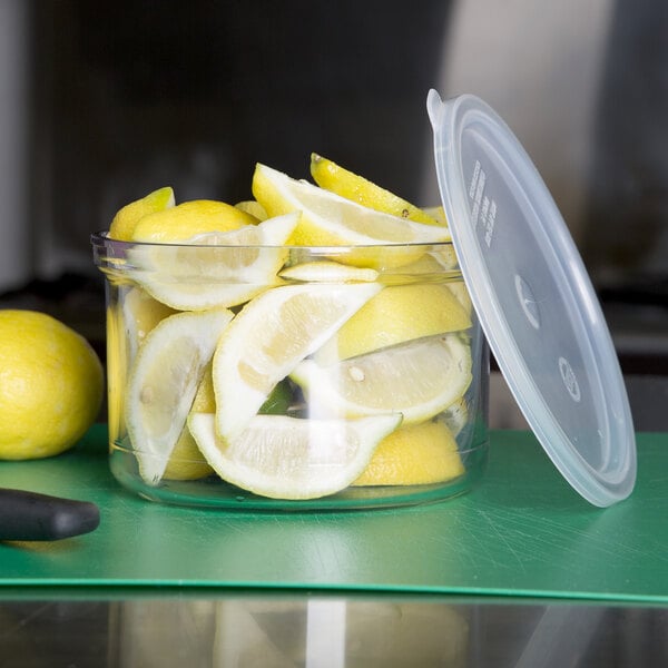A Carlisle clear plastic crock filled with lemons.