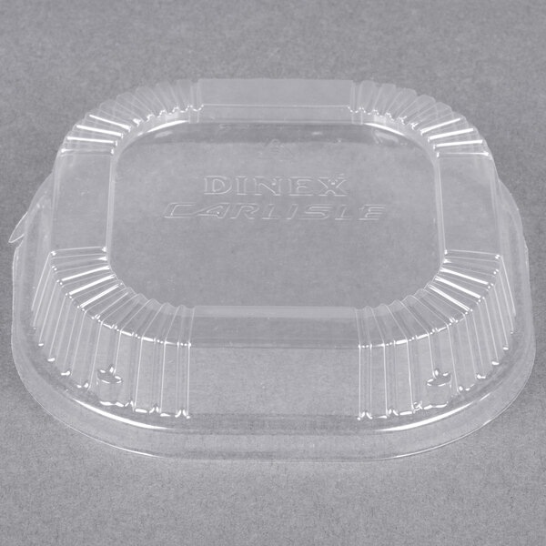 A clear plastic container with a Dinex clear dome lid on it.