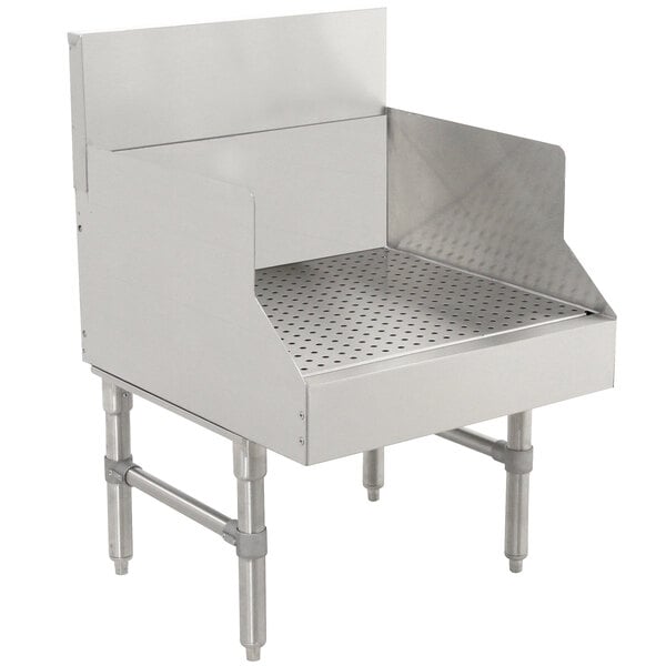 A stainless steel recessed bar drainboard with a drain on it.