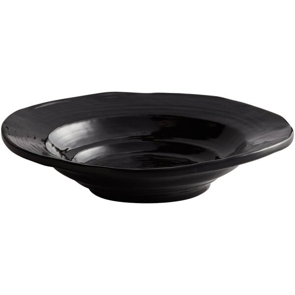 A black Elite Global Solutions melamine bowl with a wavy rim.