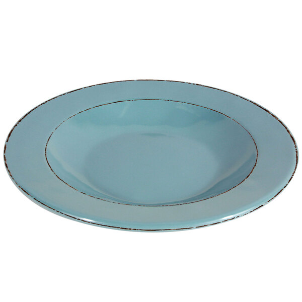A blue bowl with brown trim and a silver rim.