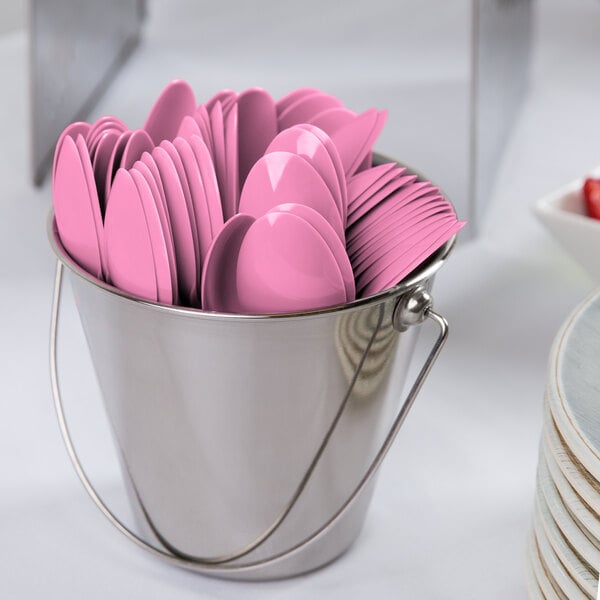 A bucket of Creative Converting Candy Pink plastic spoons.