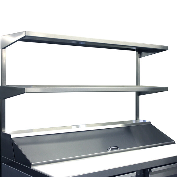 A stainless steel Continental Refrigerator double overshelf on a counter.