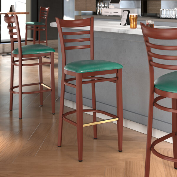 Lancaster Table & Seating Spartan Series Metal Ladder Back Bar Stool with Mahogany Wood Grain Finish and Green Vinyl Seat - Detached Seat