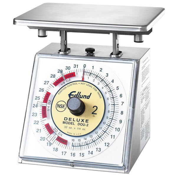 An Edlund Deluxe Over / Under Portion Scale on a deli counter.