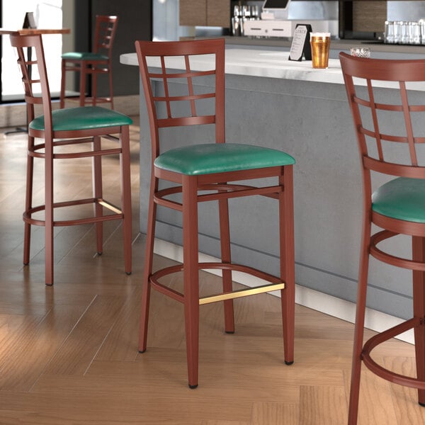Lancaster Table & Seating Spartan Series Metal Window Back Bar Stool with Mahogany Wood Grain Finish and Green Vinyl Seat - Assembled