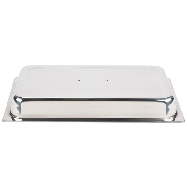 A stainless steel Vollrath chafer tray with a lid on a counter.