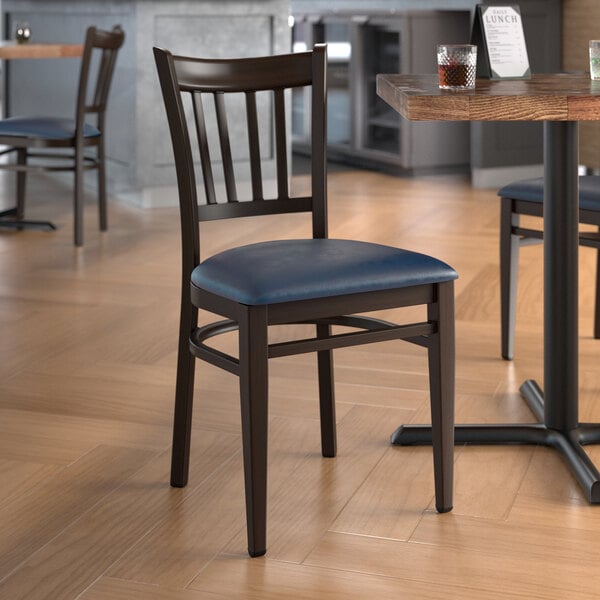 Lancaster Table & Seating Spartan Series Metal Slat Back Chair with Dark Walnut Wood Grain Finish and Navy Vinyl Seat - Assembled