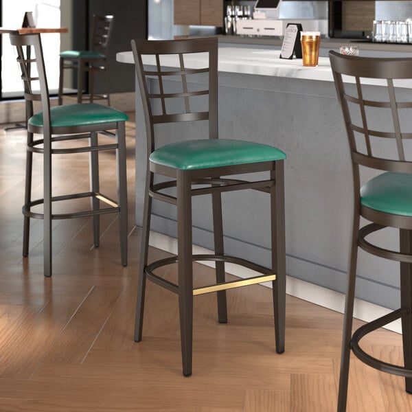 Lancaster Table & Seating Spartan Series Metal Window Back Bar Stool with Dark Walnut Wood Grain Finish and Green Vinyl Seat - Assembled
