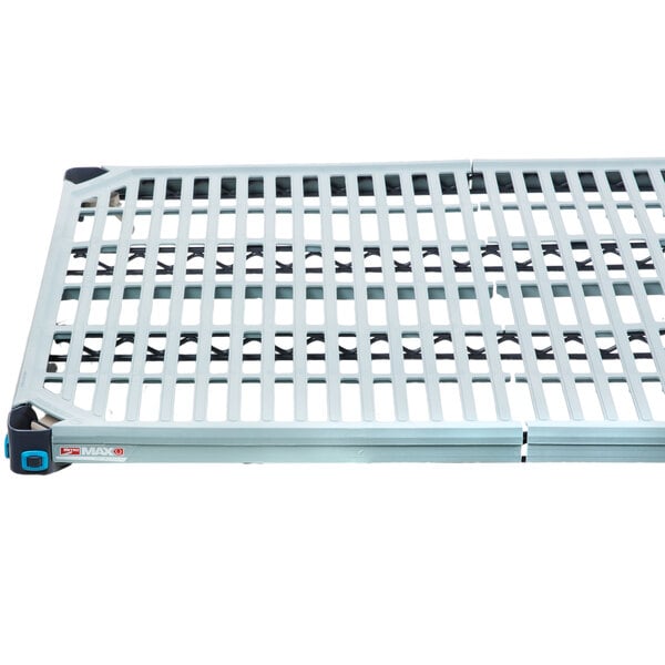 A MetroMax Q metal shelf with holes in it.