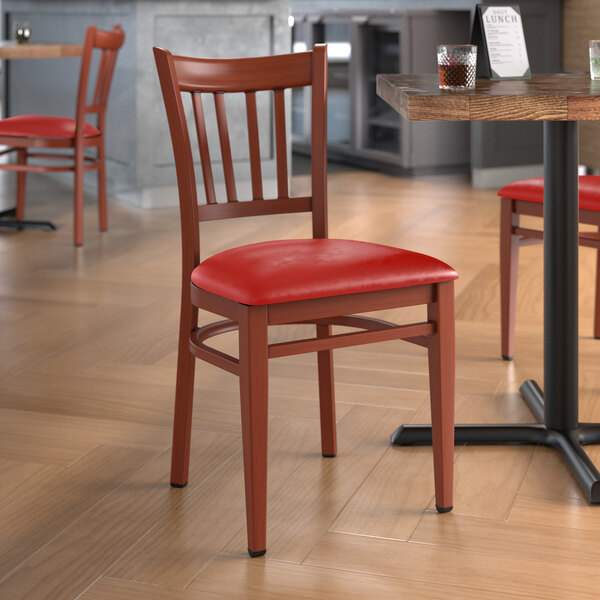 Lancaster Table & Seating Spartan Series Metal Slat Back Chair with Mahogany Wood Grain Finish and Red Vinyl Seat