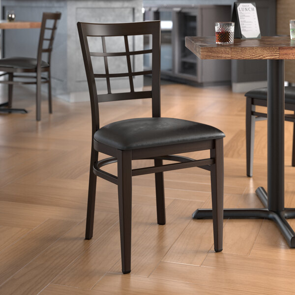 Lancaster Table & Seating Spartan Series Metal Window Back Chair with Walnut Wood Grain Finish and Black Vinyl Seat