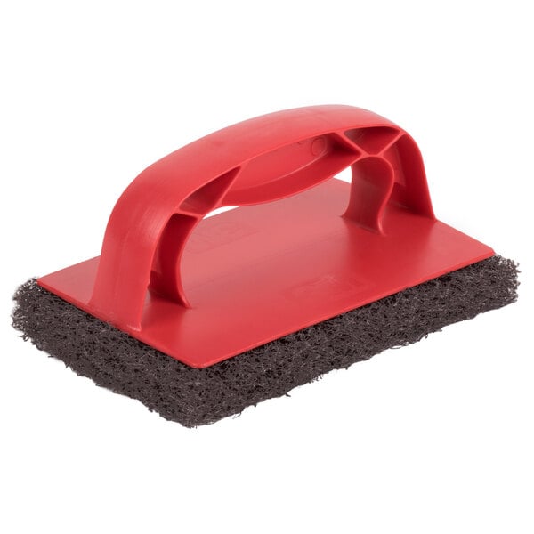 A red and black 3M Scotch-Brite sponge with a red handle.