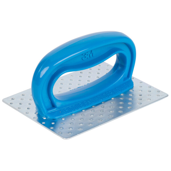 A blue plastic tool with a blue handle on a metal plate.