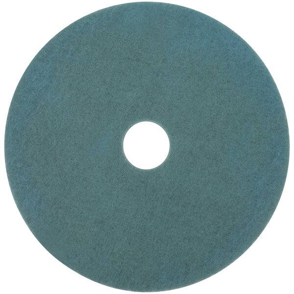 A blue circular 3M Aqua burnishing floor pad with a white circle and a black border in the middle.