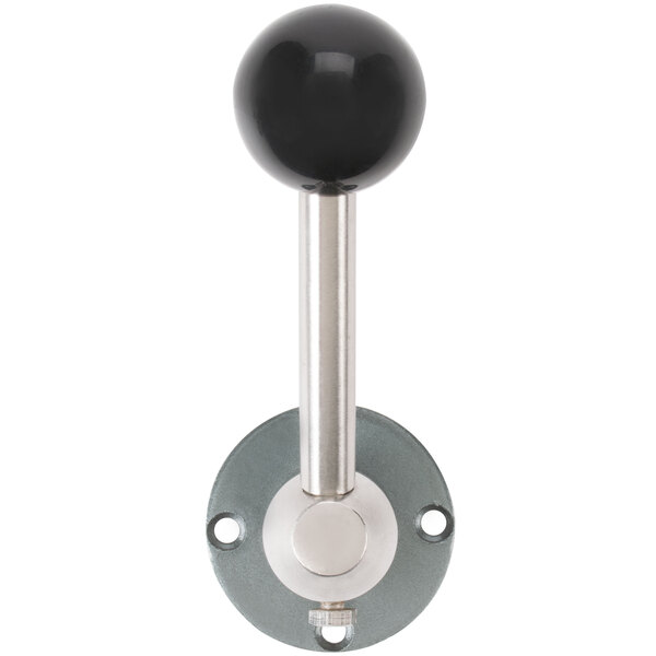 A close-up of a black and white speed changing lever with a cylindrical black end.