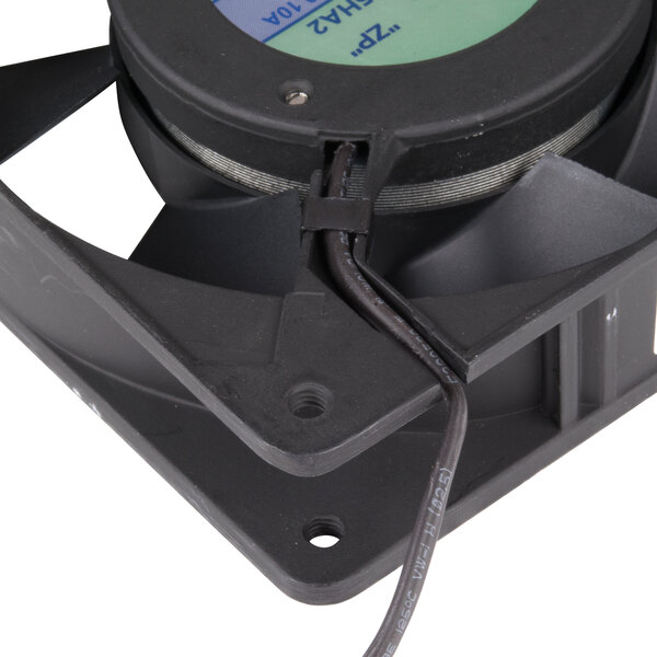 An Avantco black fan with blue and green wires attached.