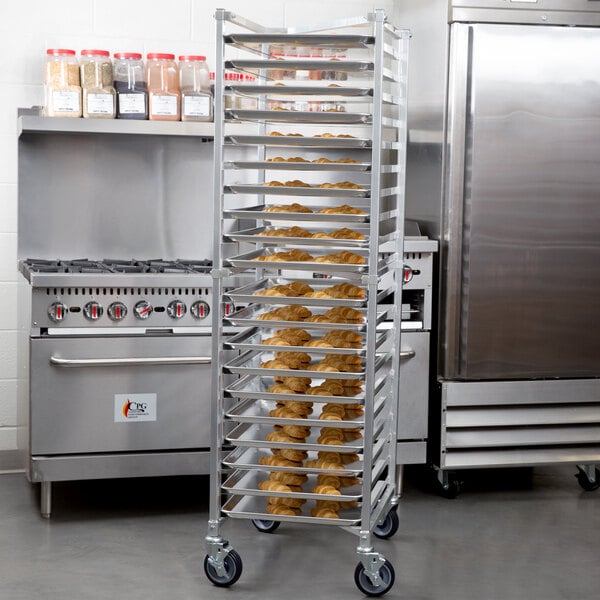A Regency end load sheet pan rack holding trays of food.