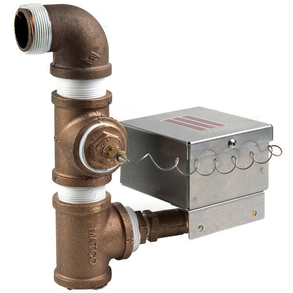 A Jackson Drain Quench System metal box with a pipe and valve.