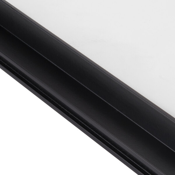 A close up of a black frame with glass panels.