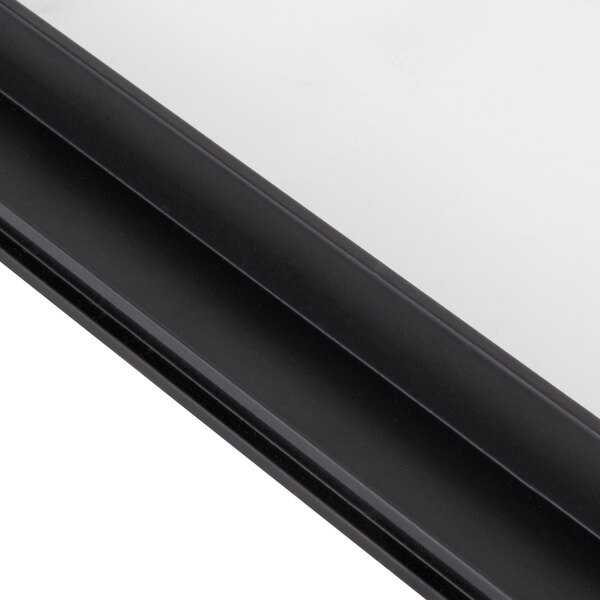 A close up of a black metal frame for an Avantco countertop food warmer back door.