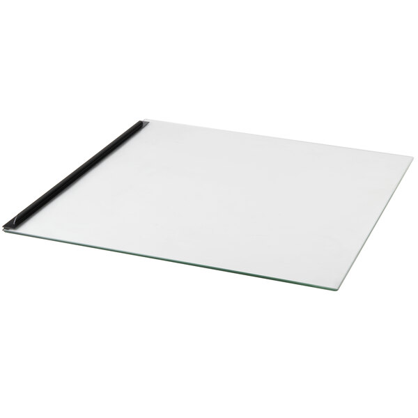 A glass board with black edges and a black handle.