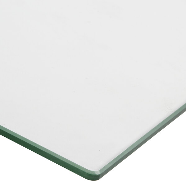 A white glass door with green edges.