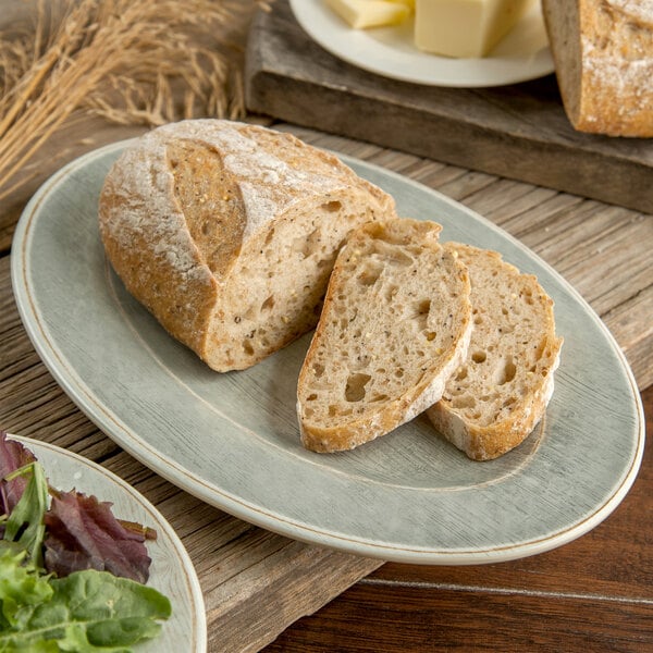 A Carlisle Grove melamine platter with bread and salad on it.
