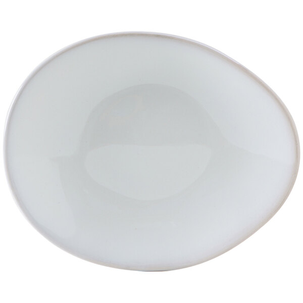 A white Tuxton china plate with an ellipse shape and a small hole in the middle.