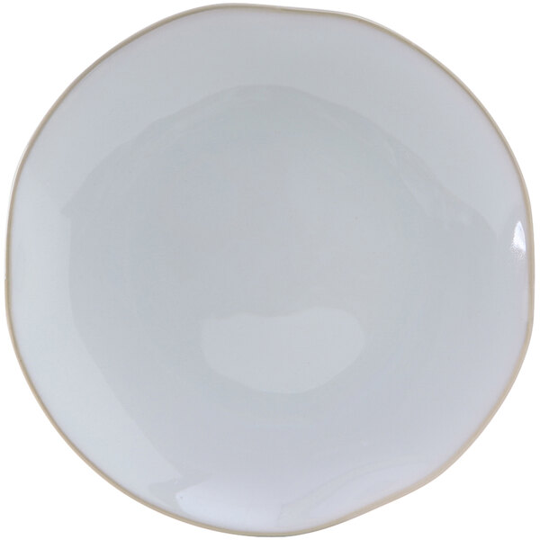 A white Tuxton Artisan china plate with a black rim.