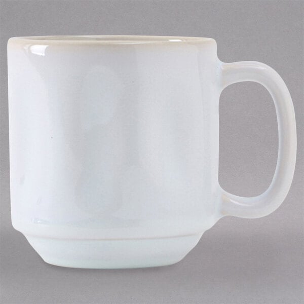 A white Tuxton Yukon China mug with a handle.