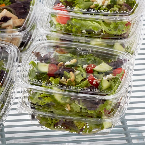 A salad in a Dart ClearPac plastic container.