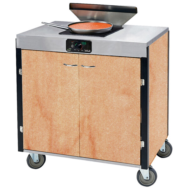 A Lakeside mobile cooking cart with an induction burner and a pan on top.